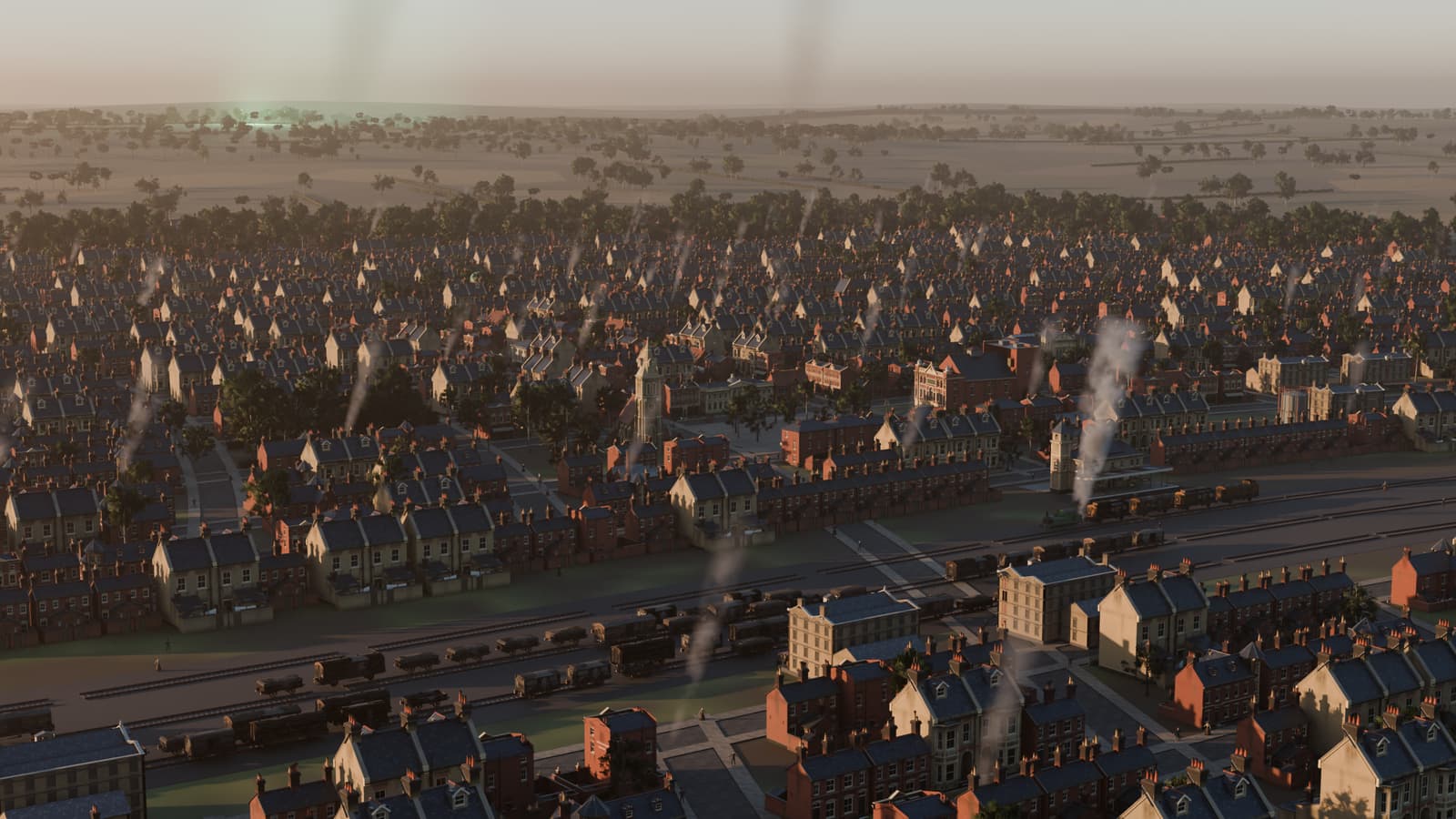 A golden-hour view over a Victorian town of terraces, chimneys and railway.